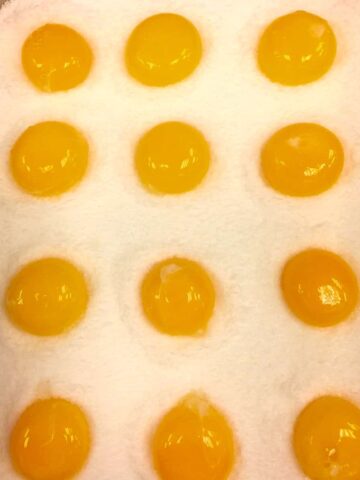 cured egg yolk in salt and sugar mixture