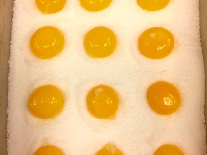cured egg yolk in salt and sugar mixture