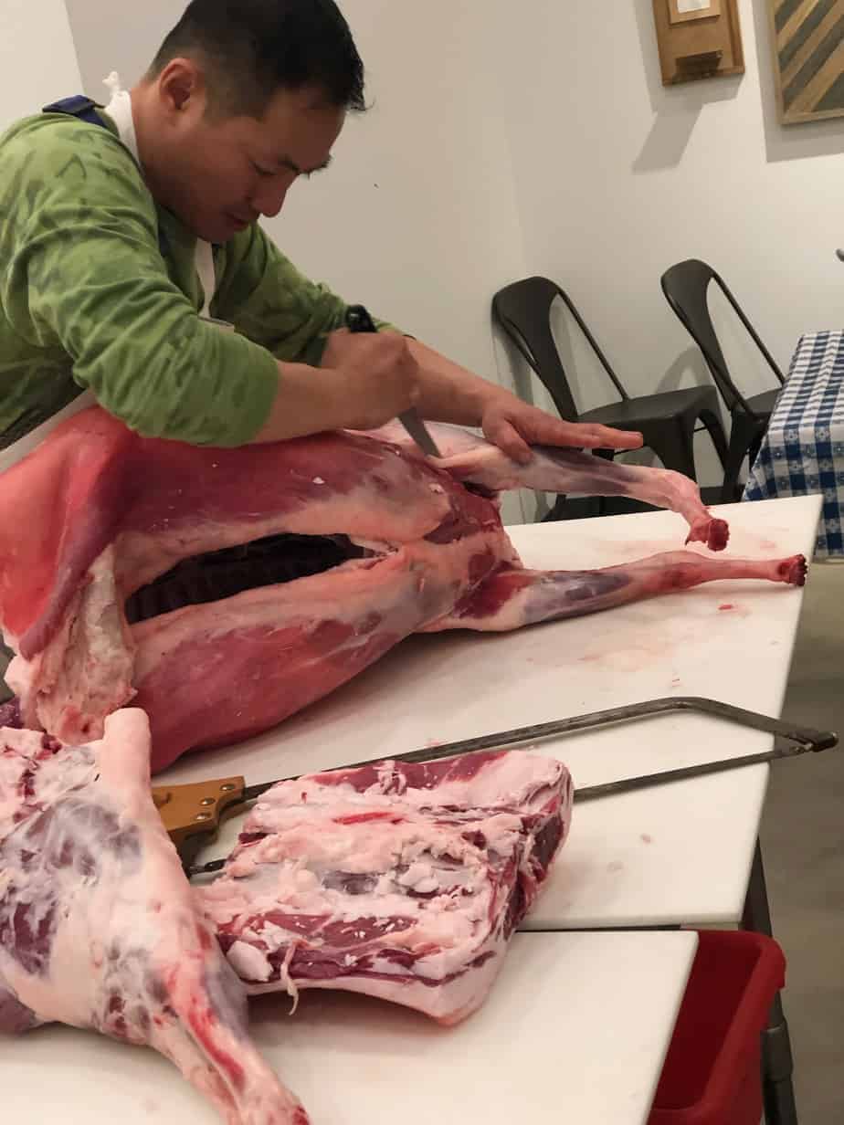 Jason Chow demonstrating lamb butchery
